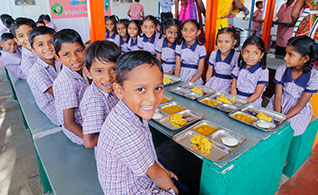 The Chetu Foundation donates $60,000 to help feed schoolchildren in India. Above are children who receive nutritious mid-day meals through the Akshaya Patra Foundation.