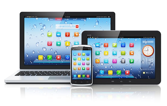 Laptop, mobile phone, and tablet with apps on home screen. Made with application development services by Chetu.